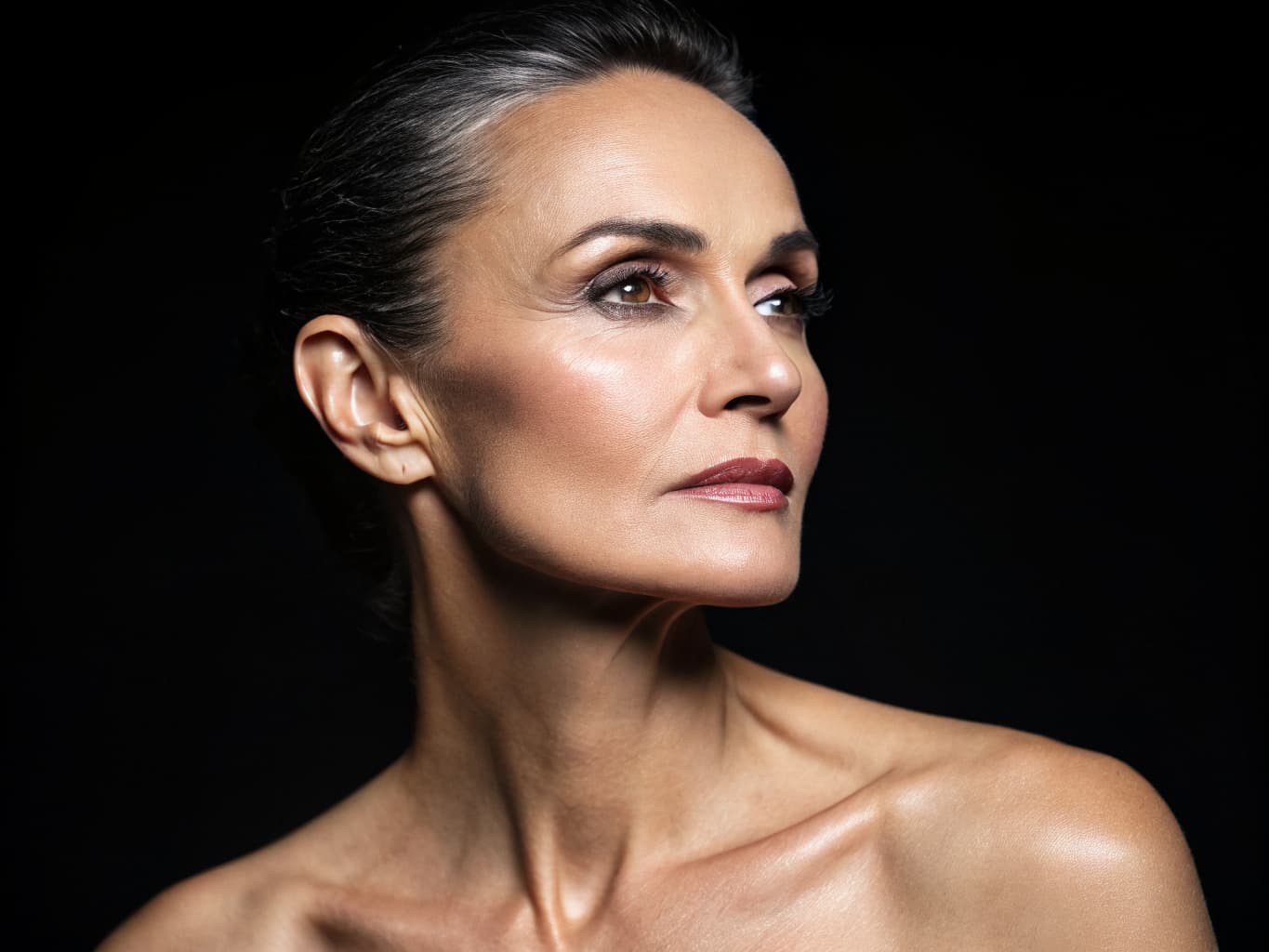 Mature elegant woman with defined jawline and youthful appearance