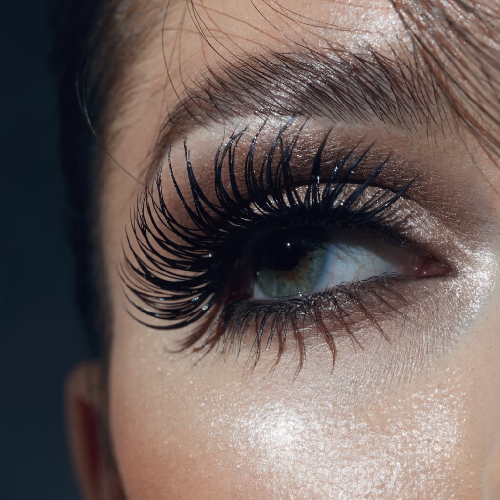 Close-up of long dark eyelashes representing Latisse results
